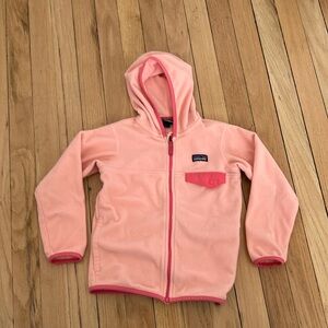 Kids Patagonia jacket. Light pink with dark pink trim.